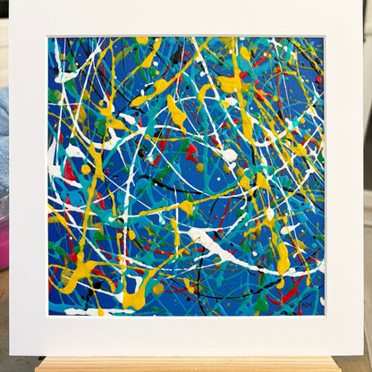 Original abstract painting Electric I by Mike Hall, featuring vibrant blue, yellow and white, presented in a buff mount.