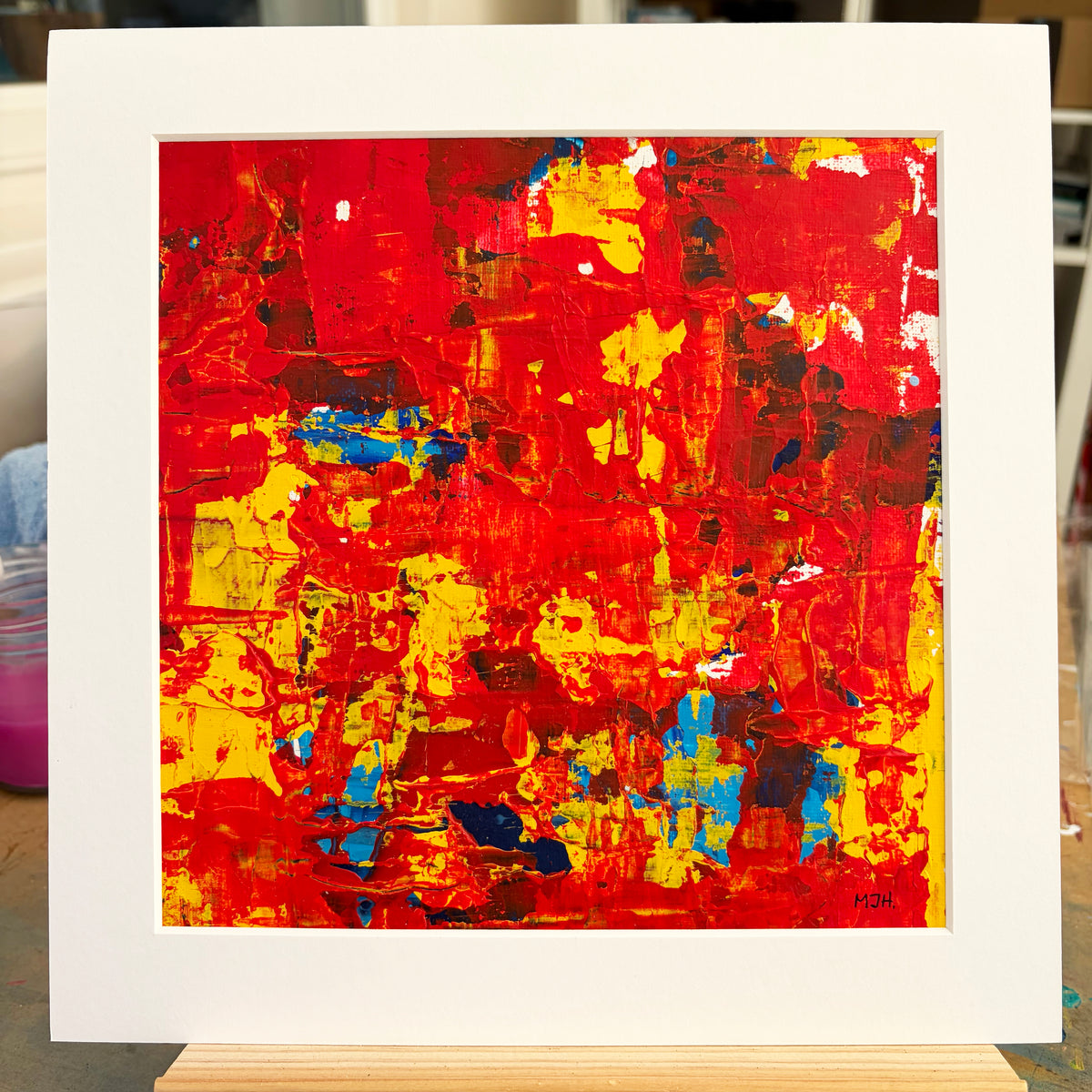 Ember II original red and orange abstract painting by Mike Hall of MJH ArtStudio, presented in a buff mount.