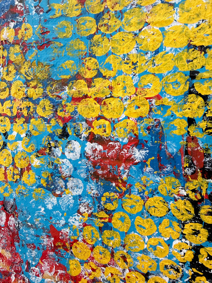 Detailed view of colourful abstract artwork featuring repeated yellow circular patterns over vibrant blue and red textured layers.