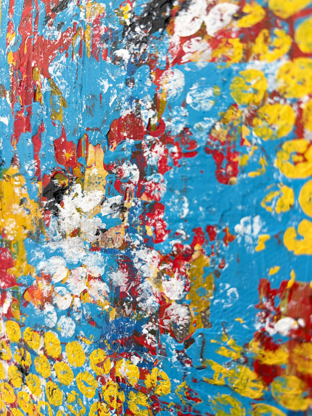 Detailed section of Pop & Circumstance I showing vivid turquoise blue, yellow circular patterns and energetic red and white paint marks.