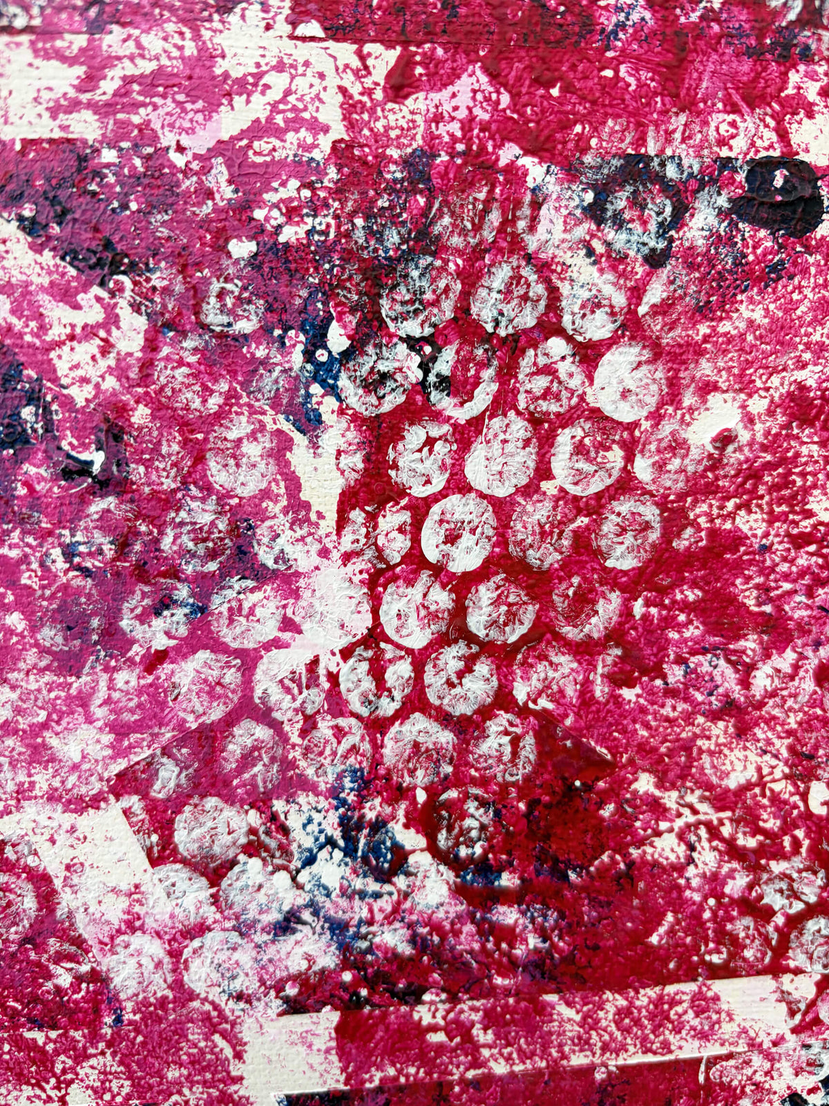 Close-up of Pop & Circumstance II showing overlapping white circular patterns against rich magenta, pink and red textured paint.