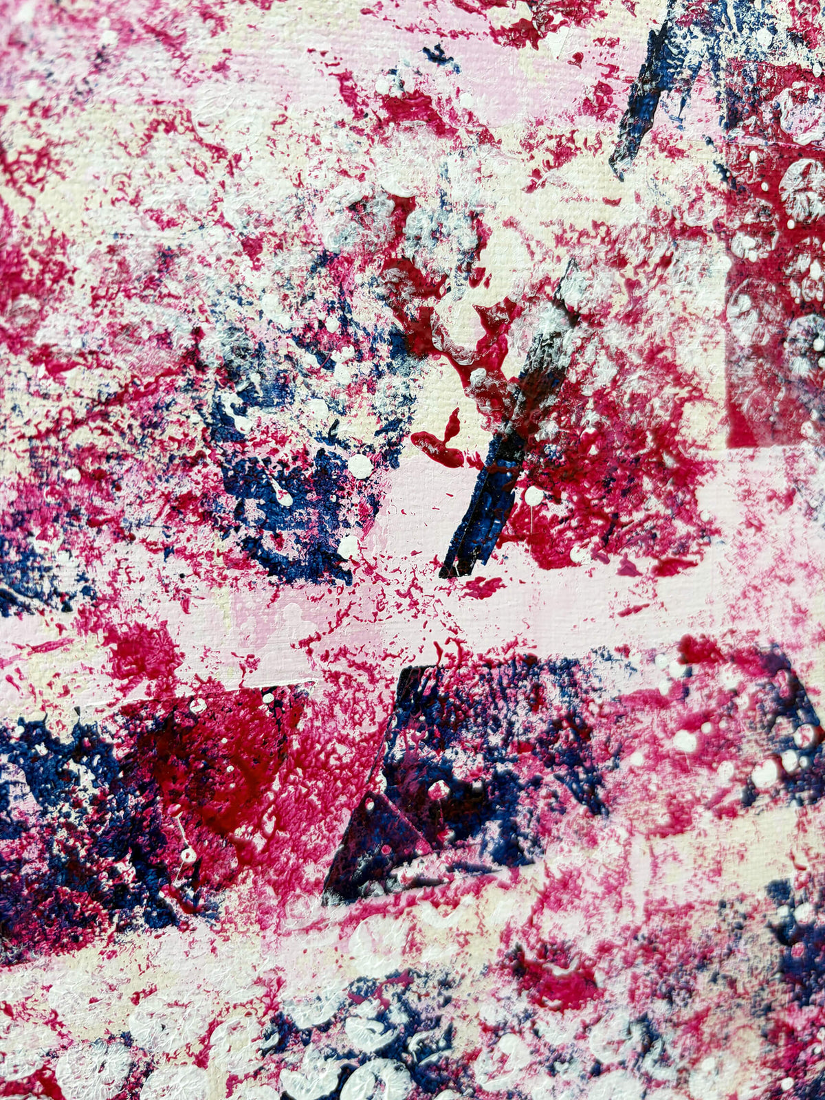 Close-up of original abstract painting featuring expressive pink, red and dark blue marks with distressed white textures and overlapping shapes.