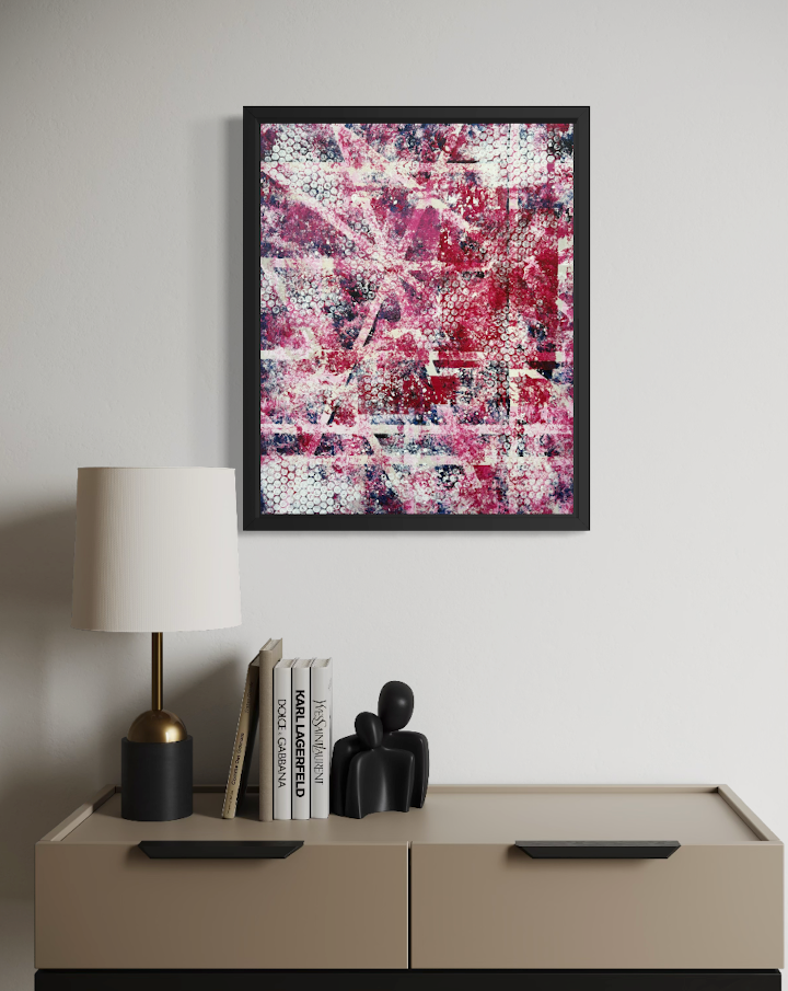 Illustrative room setting featuring pink and red abstract painting by Mike Hall in a black frame above a modern neutral sideboard.