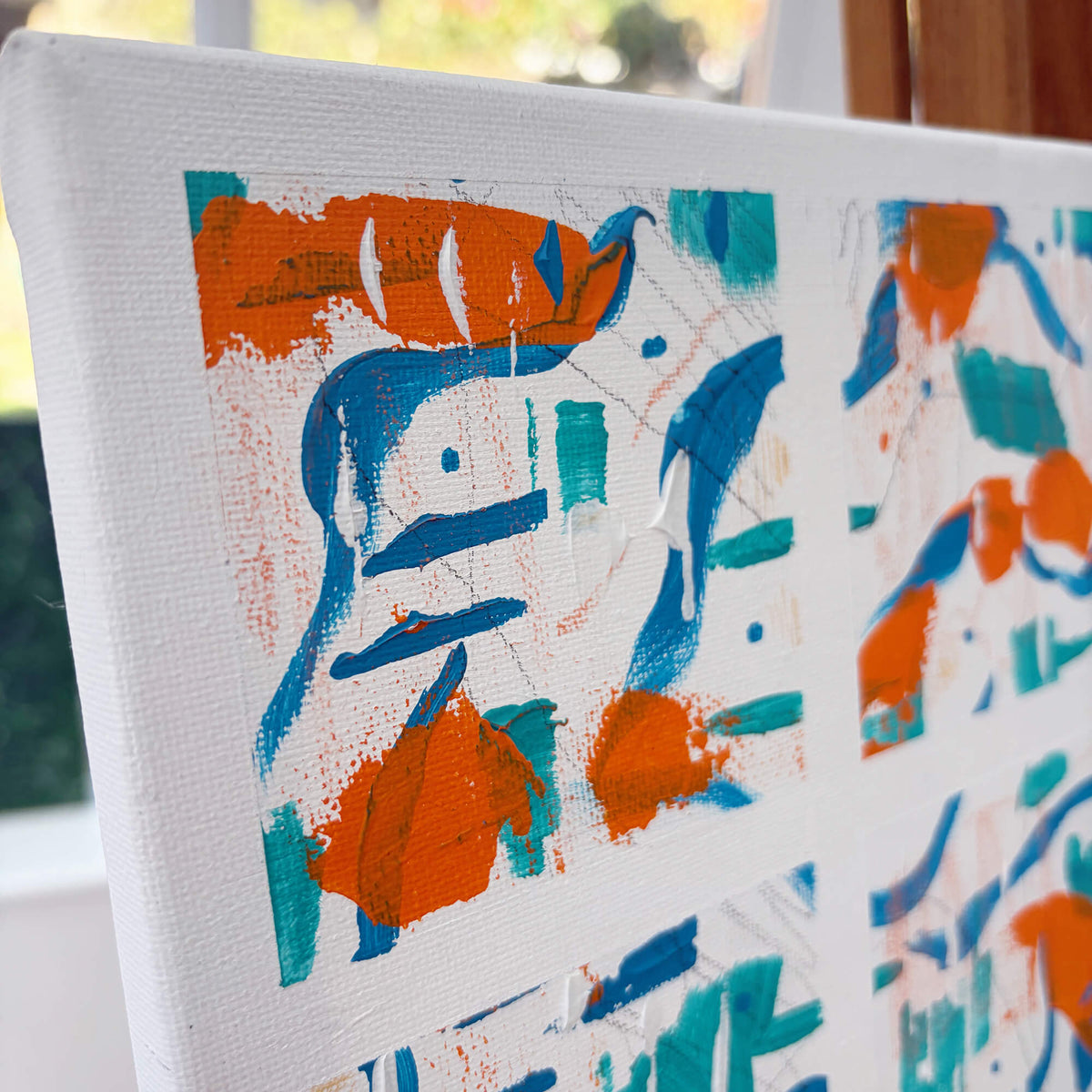 Angled view of Squared-Up original canvas artwork by Mike Hall, showing the colourful abstract composition and painted surface.