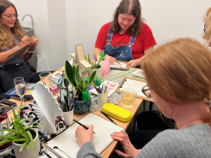 Team members taking part in a creative workshop together