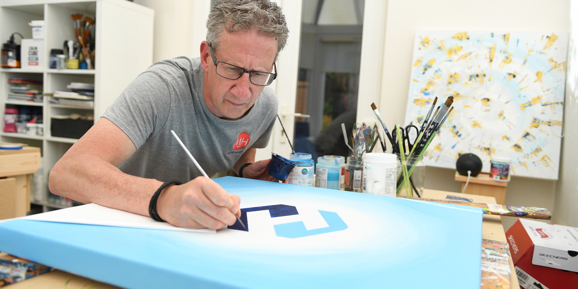 Bespoke brand artwork being created by hand in the studio