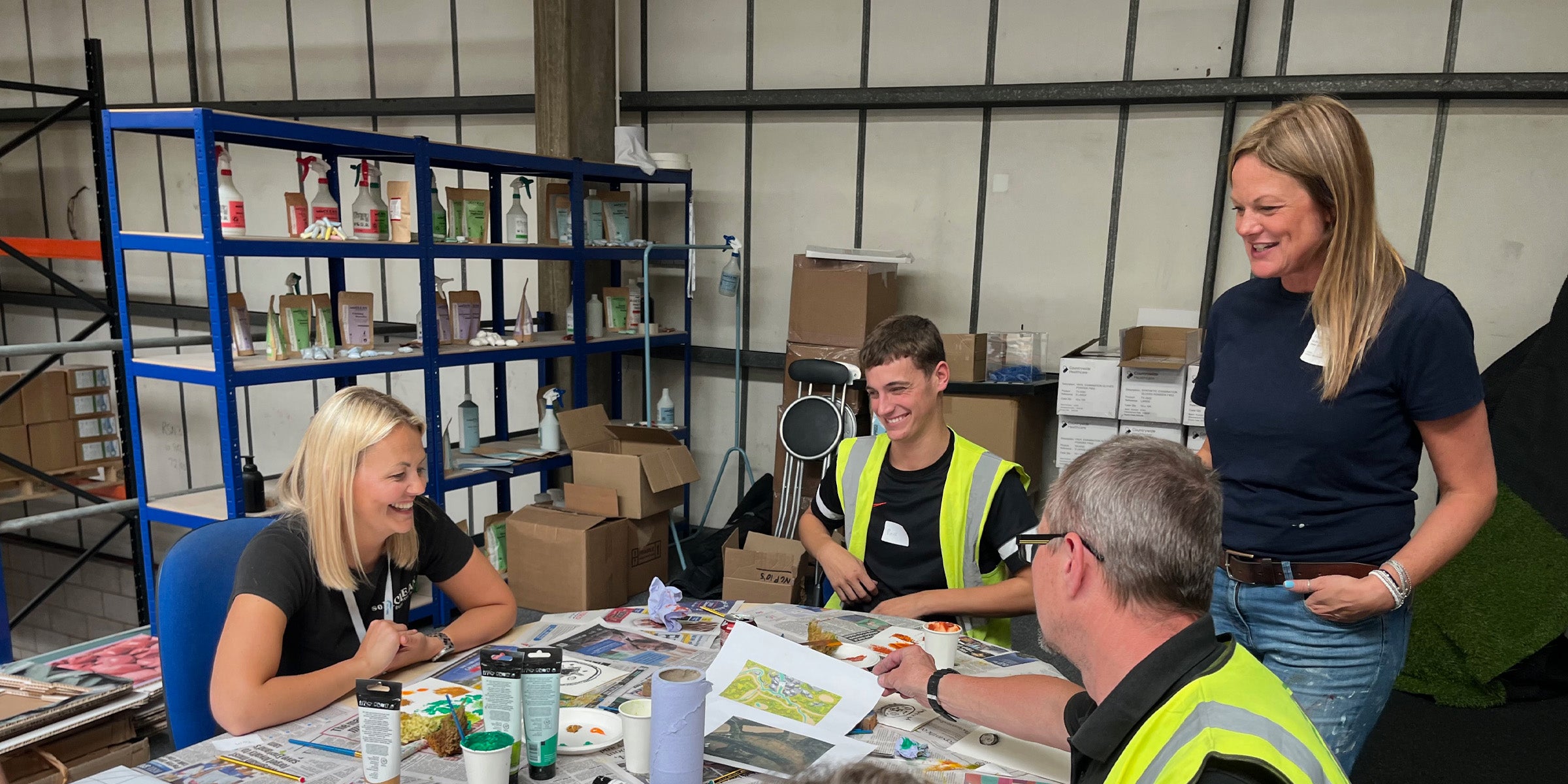 Employees taking part in a creative workshop designed for their workplace