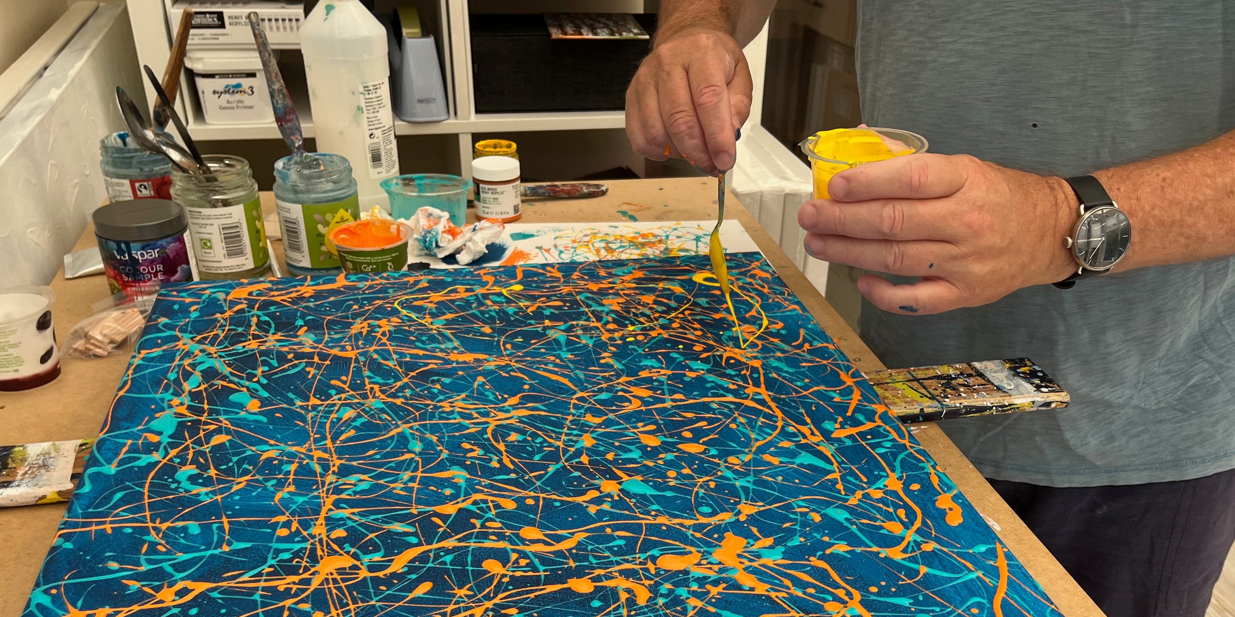 A one-to-one creative workshop with abstract painting in progress