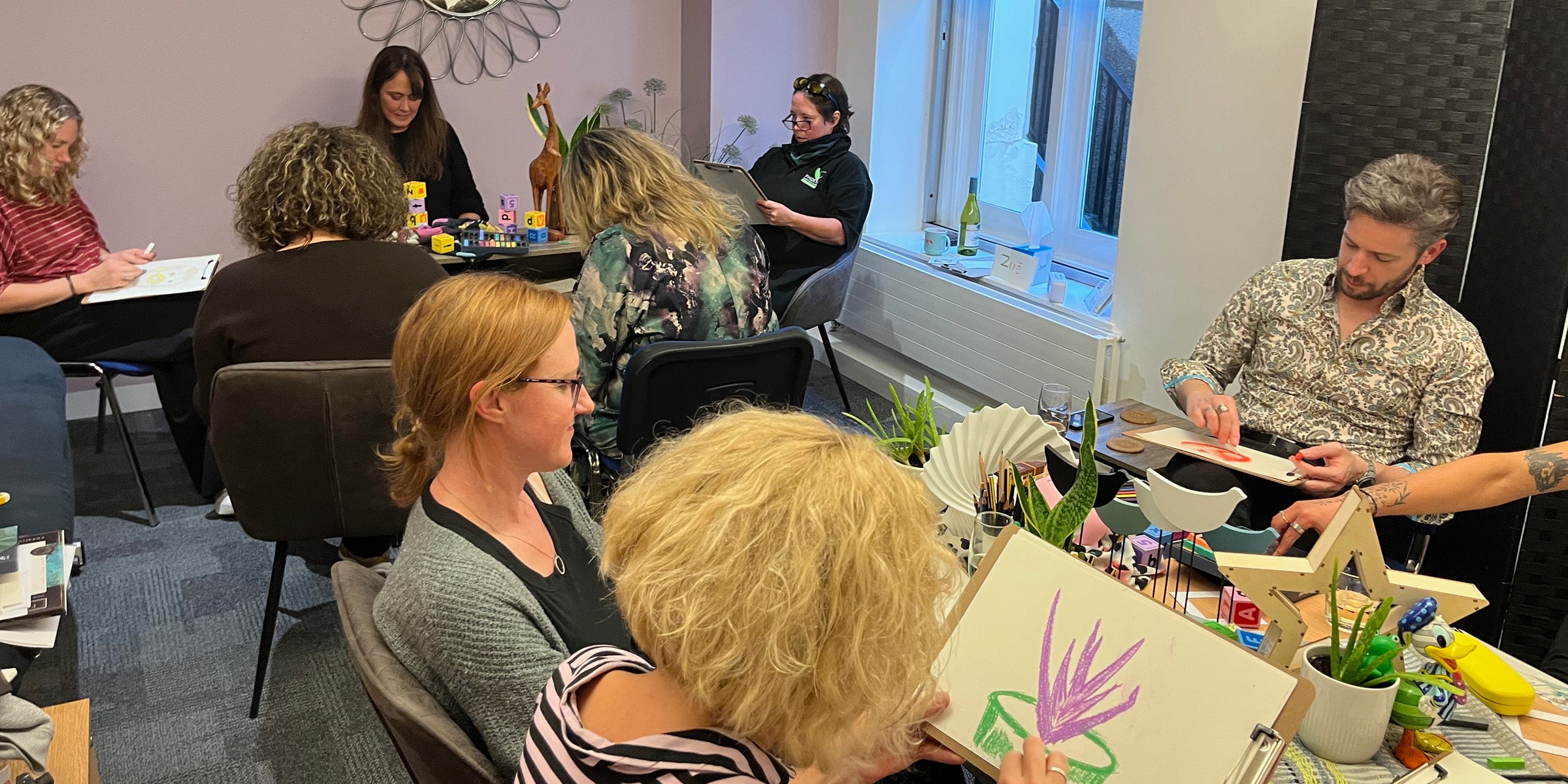 A team taking part in a collaborative creative workshop at work